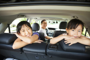 happy family sitting in the car